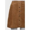 Suede skirt decorated with buttons
