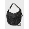 Leather hobo bag decorated with beads