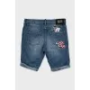 Denim shorts decorated with embroidery