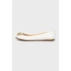White leather ballet shoes with decor