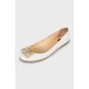 White leather ballet shoes with decor