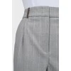 Gray tapered pants with white stripes