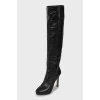 Black leather high heel boots