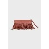 Leather clutch decorated with fringe