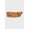 Thin brown leather belt