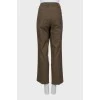 Straight brown trousers with arrows