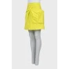 Yellow skirt decorated with a bow