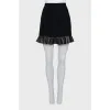 Black mini skirt with ruffled hem