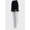 Black mini skirt with ruffled hem