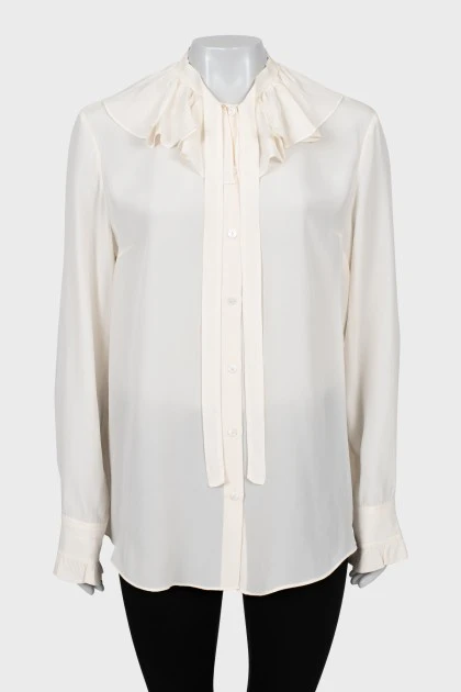 Beige blouse with ruffles
