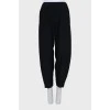 Black tapered trousers with elastic