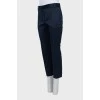 Blue trousers with stitched creases
