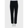 Black and white trousers with stitched creases