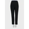 Black and white trousers with stitched creases