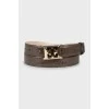Patent leather belt with gold buckle