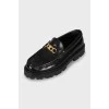 Leather loafers with gold detailing