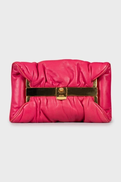 Pink clutch with gold fittings
