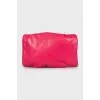 Pink clutch with gold fittings