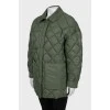 Reversible quilted jacket with tag