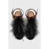 Suede sandals decorated with feathers