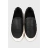 Leather slip-ons with white soles