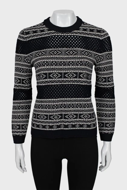 Sweater with perforation and pattern