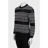Sweater with perforation and pattern