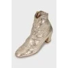Gold embossed ankle boots