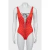 One-piece swimsuit with laces and tag
