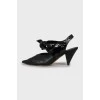 Leather slingbacks with lacquer bow
