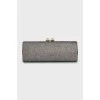 Shiny clutch with gold hardware