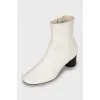 White leather ankle boots