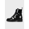 Black leather boots with silver hardware