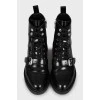 Black leather boots with silver hardware