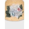 Straw hat decorated with flowers with tag