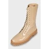 Beige patent leather boots