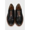 Leather brogues with brown laces