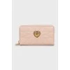 Pink leather wallet with tag