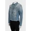 Denim jacket decorated with beads