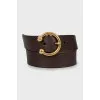 Brown belt with gold buckle