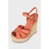 Leather sandals with woven wedge heel