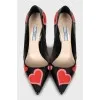 Patent leather shoes decorated with hearts