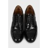 Black patent leather brogues
