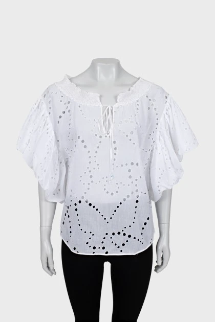 Loose blouse with perforations