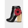 Leather ankle boots decorated with flowers