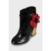 Leather ankle boots decorated with flowers