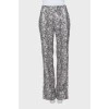 Eco-leather trousers in animal print