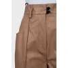 Leather Bermuda shorts with stitched arrows