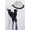 Sweatshirt decorated with sequins and feathers