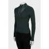 Green jumper with perforations